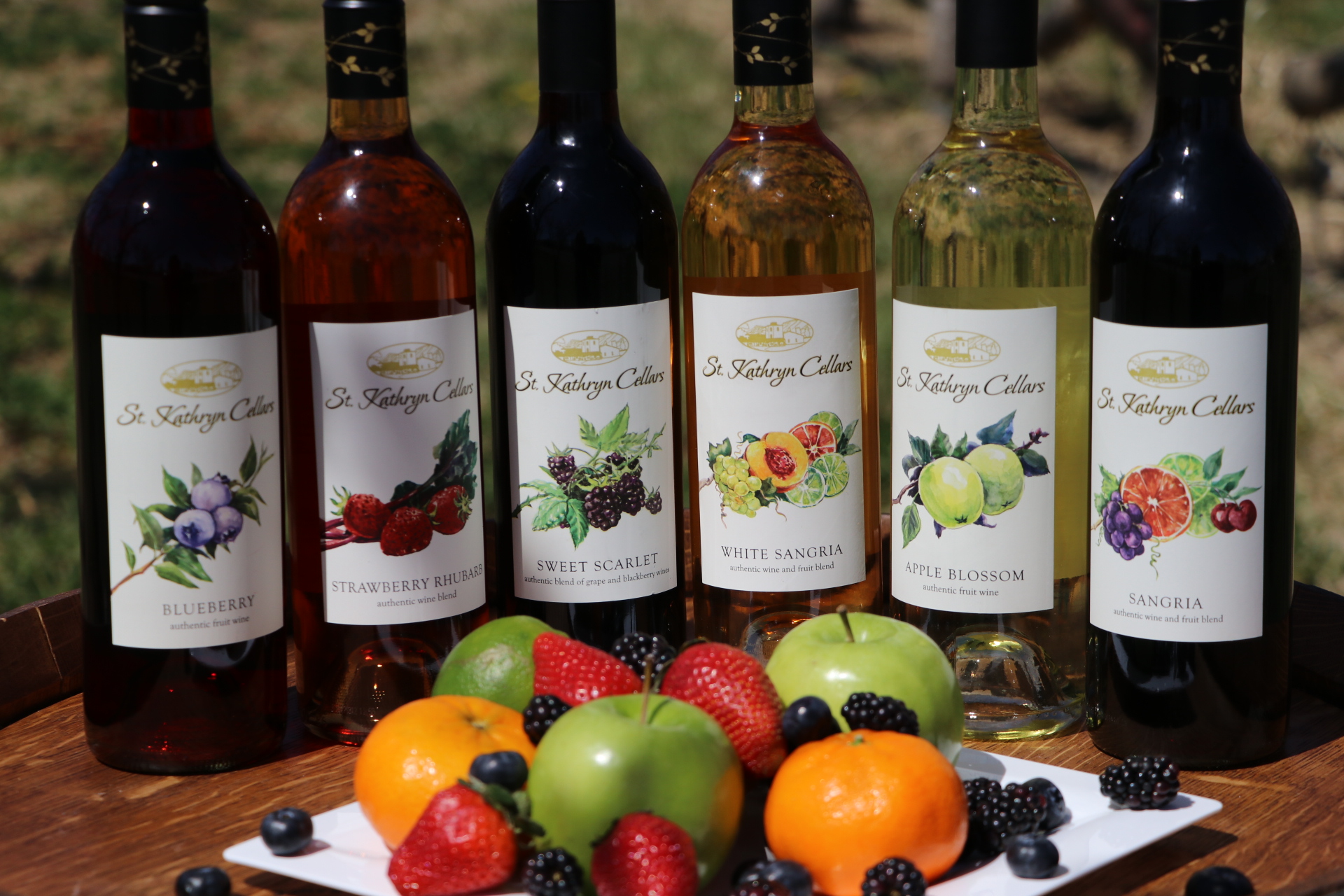 Bottles of St Kathryn Wine on a table with a plate of fruit